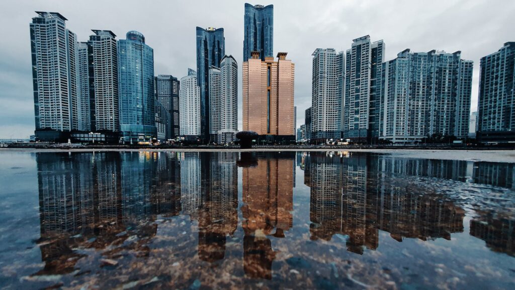 reflection of high rise buildings on water surface
